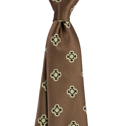 Brown tie with clover pattern on a white background