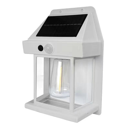 Solar-powered outdoor light fixture with motion sensor on a white background