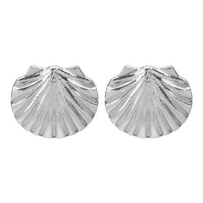 Silver shell-shaped earrings on a white background