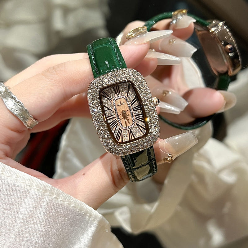 Women's diamond waterproof quartz watch with green leather-look strap and sparkly bezel