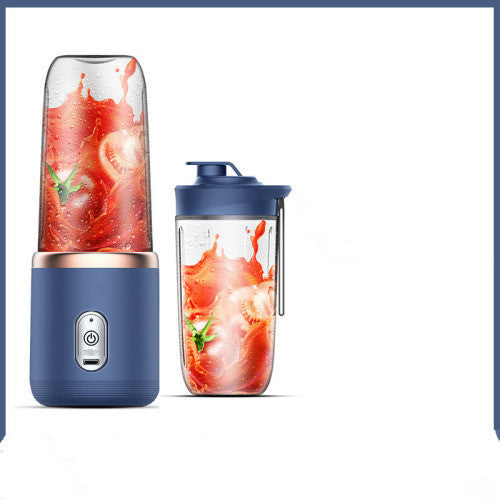 Blue portable blender with a clear container filled with a red smoothie on a white background