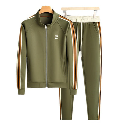 Green tracksuit with side stripes on hangers against a white background