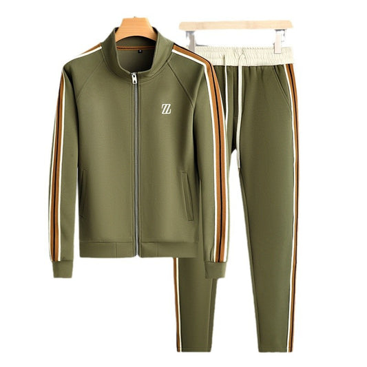 Green tracksuit with side stripes on hangers against a white background