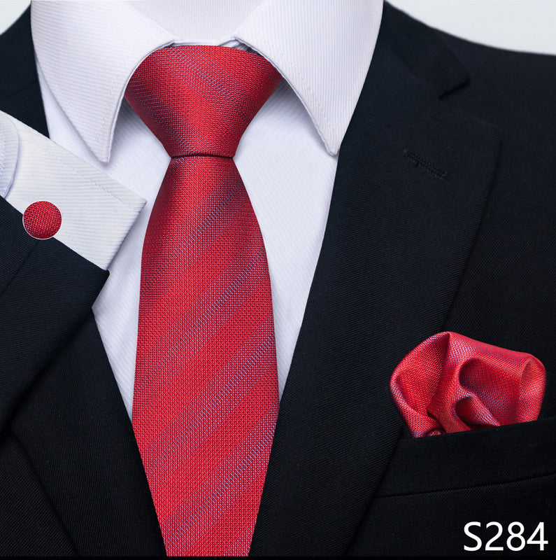 Red striped tie and matching pocket square with a black suit and white shirt.