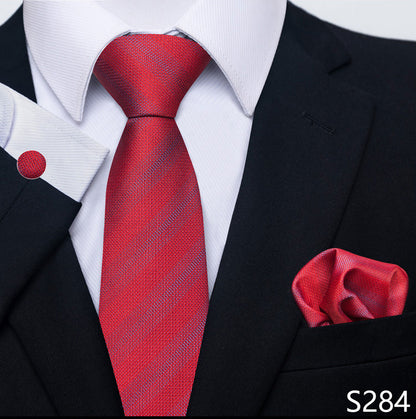 Red striped tie and matching pocket square with a black suit and white shirt.