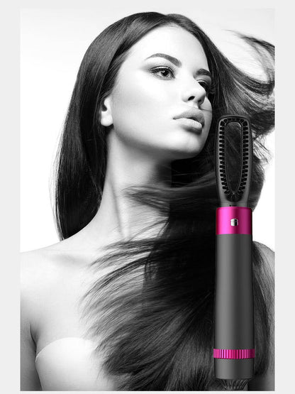 5-in-1 hair dryer brush with grey body and pink accents, showing the round heated bristle head.