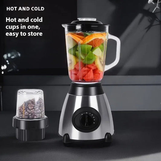 Blender with fruits and vegetables on a dark background