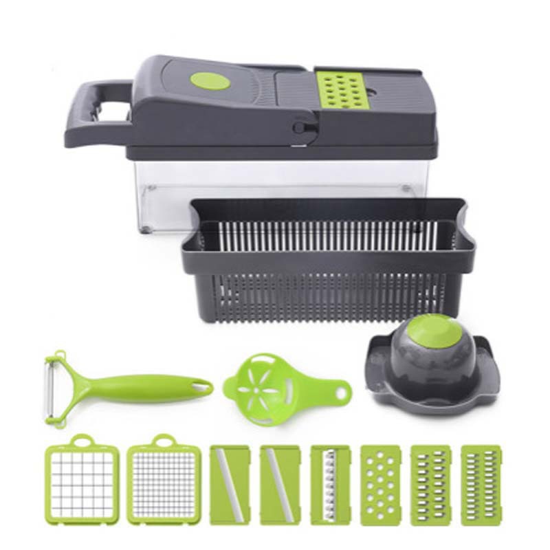 Gray vegetable cutter with green handle, mandoline insert blades and slicer parts