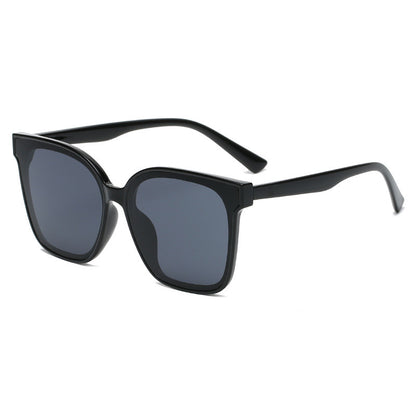 Black sunglasses with dark lenses on a white background
