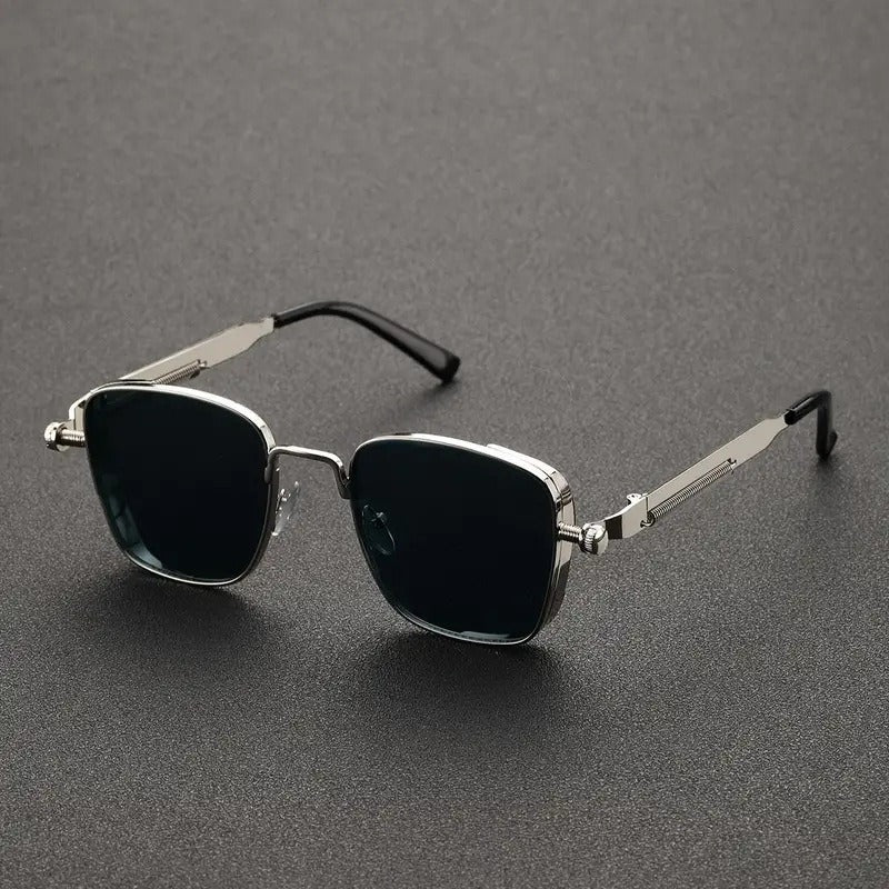 Sunglasses with thin metal frame on a gray background