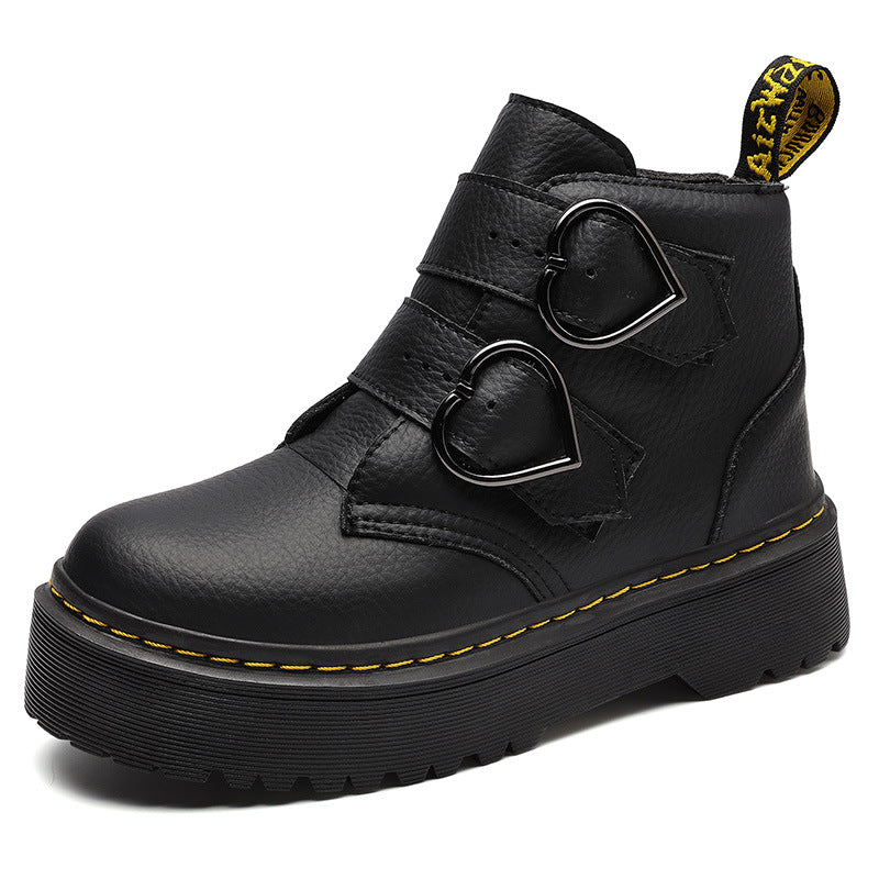 Black leather boot with heart-shaped buckles on a white background