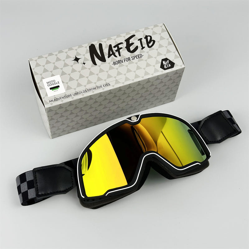 Black motorcycle goggles with bright yellow reflective lens and adjustable strap