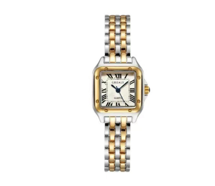 Two-tone watch with gold and silver band on a white background