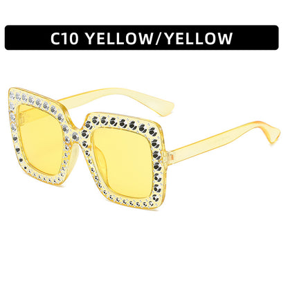Yellow sunglasses with decorative elements on a white background