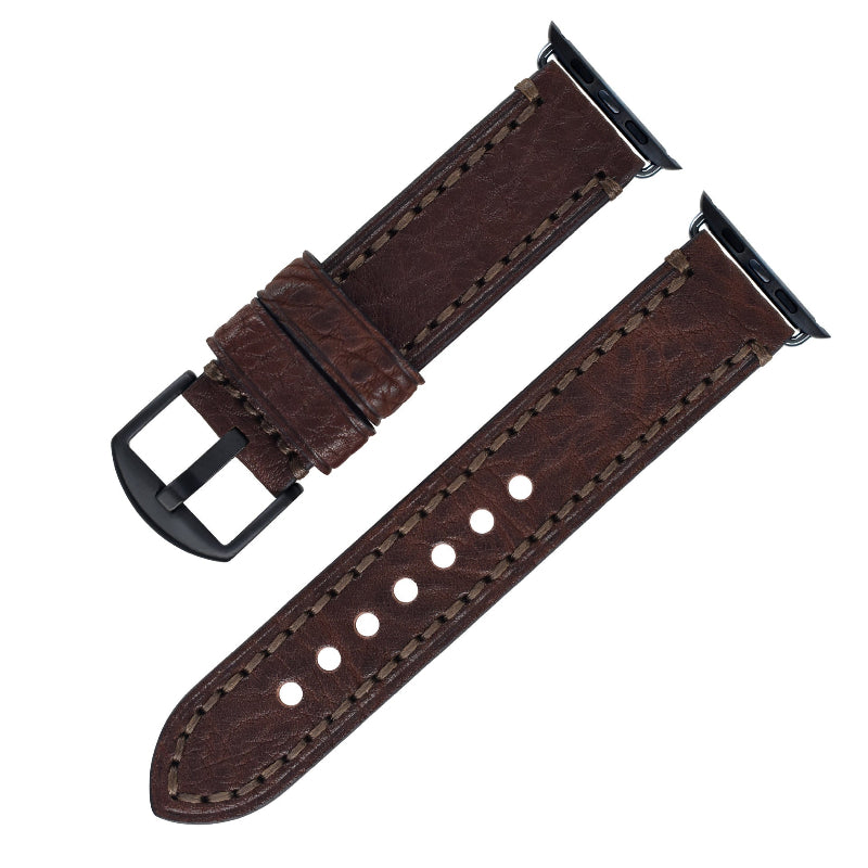 Brown leather watch strap with black buckle on a white background