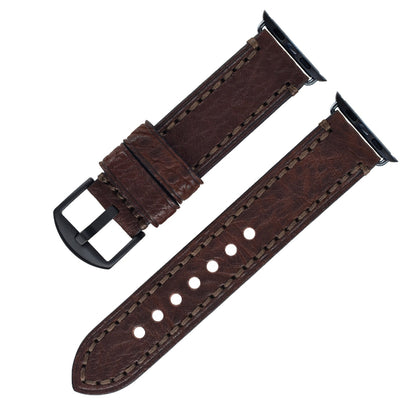 Brown leather watch strap with black buckle on a white background