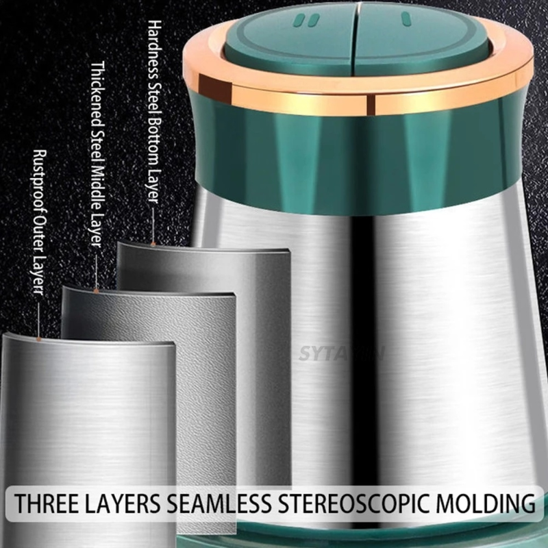 Stainless steel container with green lid and gold rim, showing three-layered construction.