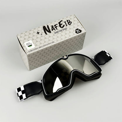 Black motorcycle goggles with dark reflective lens and adjustable strap