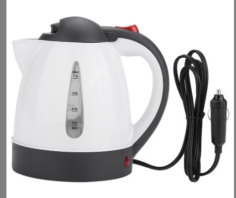 White electric kettle with black base and cord on a white background