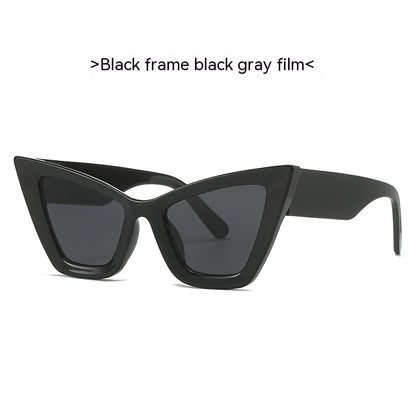 Black cat-eye sunglasses with black gray film lenses on a white background