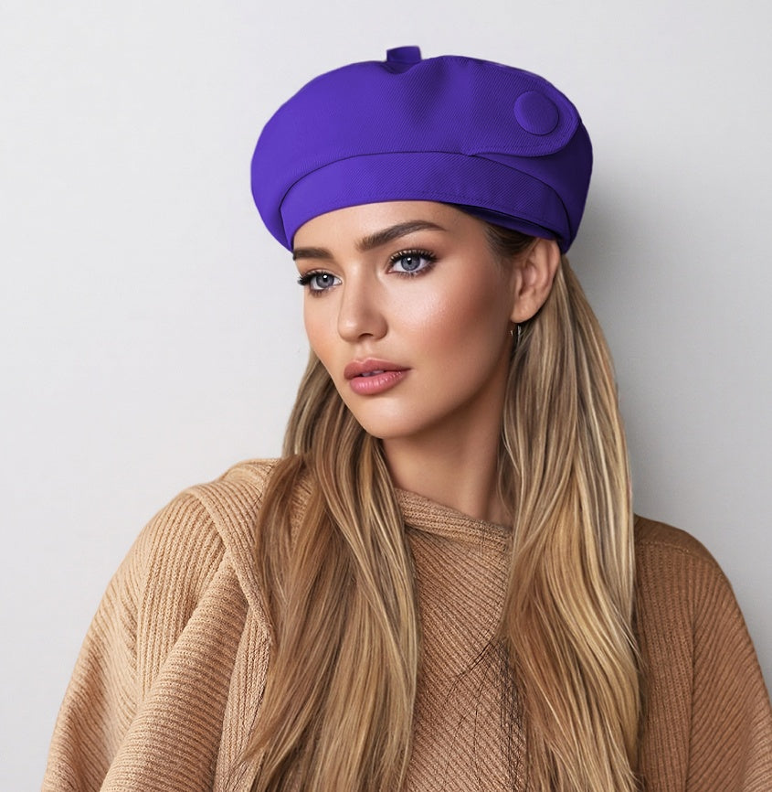 Purple satin button beret with side button detail, compact rounded crown.