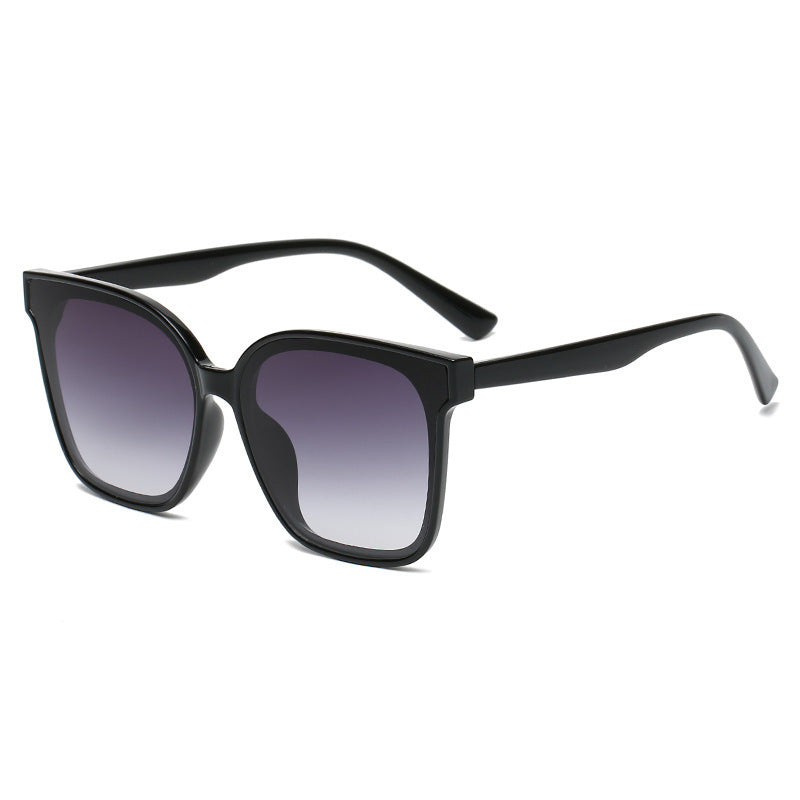 Black sunglasses with gradient lenses on a white background