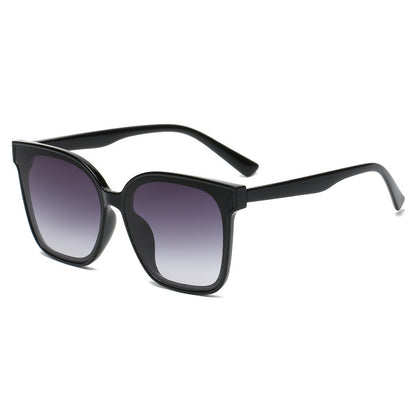 Black sunglasses with gradient lenses on a white background