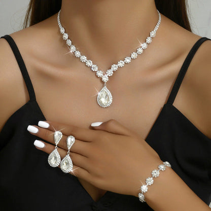 Rhinestone bridal jewelry set: white teardrop necklace, matching earrings and bracelet