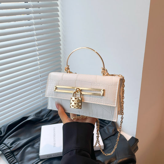 Women’s chain crossbody bag in white PU leather with gold-tone hardware and lock charm