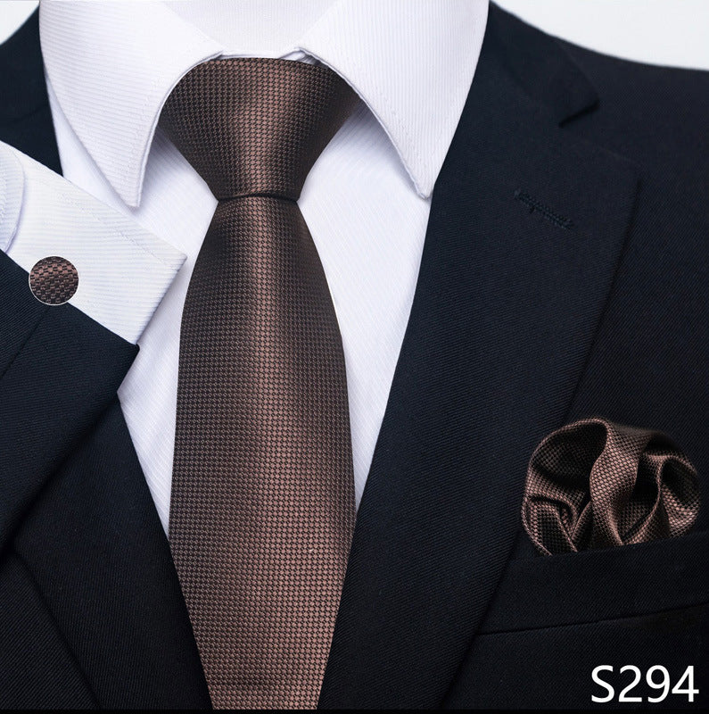 Brown tie and pocket square set with a suit on a white background