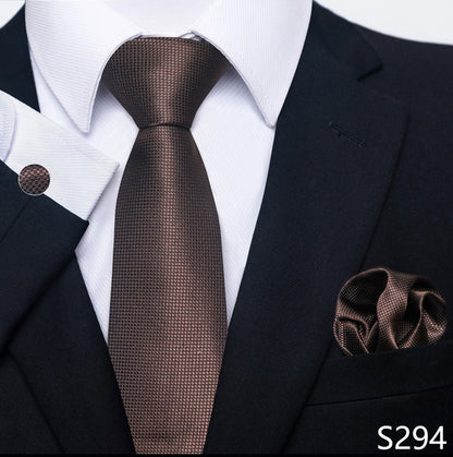 Brown tie and pocket square set with a suit on a white background
