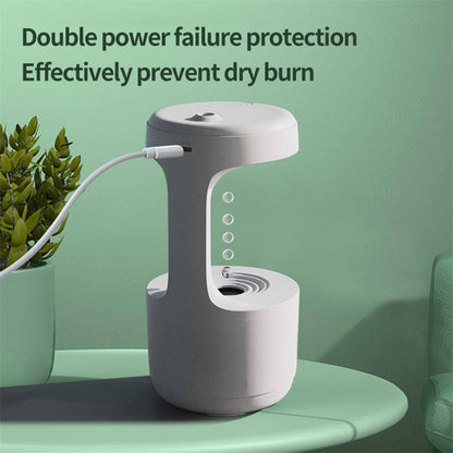 White electronic device with USB cable on a green surface, featuring text about power failure protection.