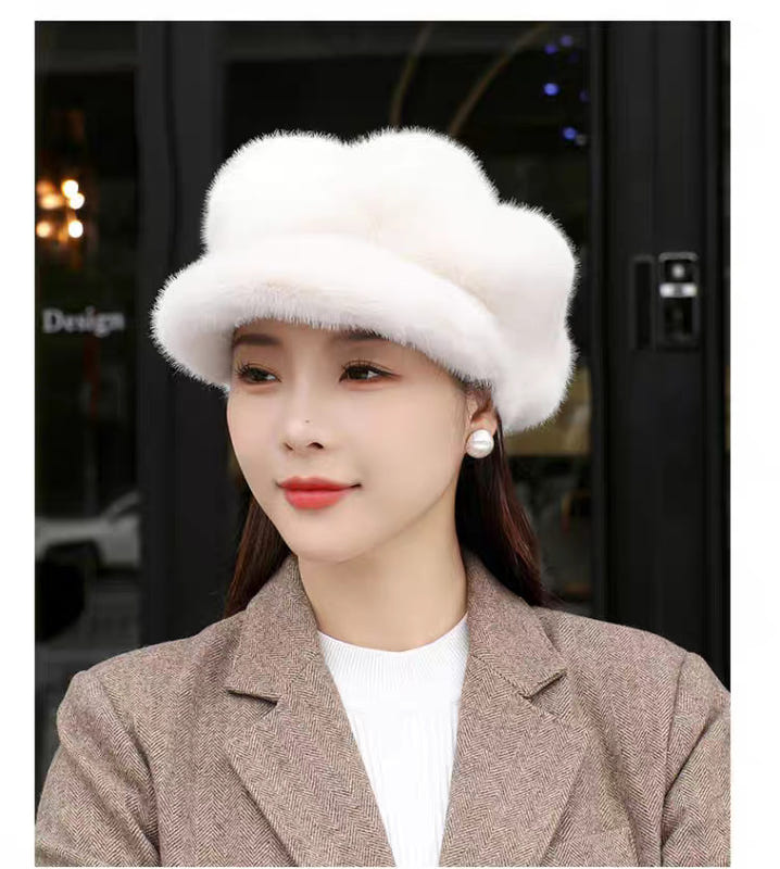White faux-fur pumpkin hat with curved brim and soft ear-covering shape