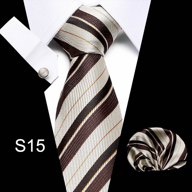 Striped tie with matching pocket square and cufflinks on a white background
