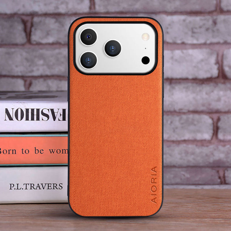 iPhone PU leather case in orange with textured back, raised camera openings, AIORIA logo