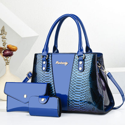 Blue shoulder tote bag with long handles, scalloped texture, front pocket, and wallet