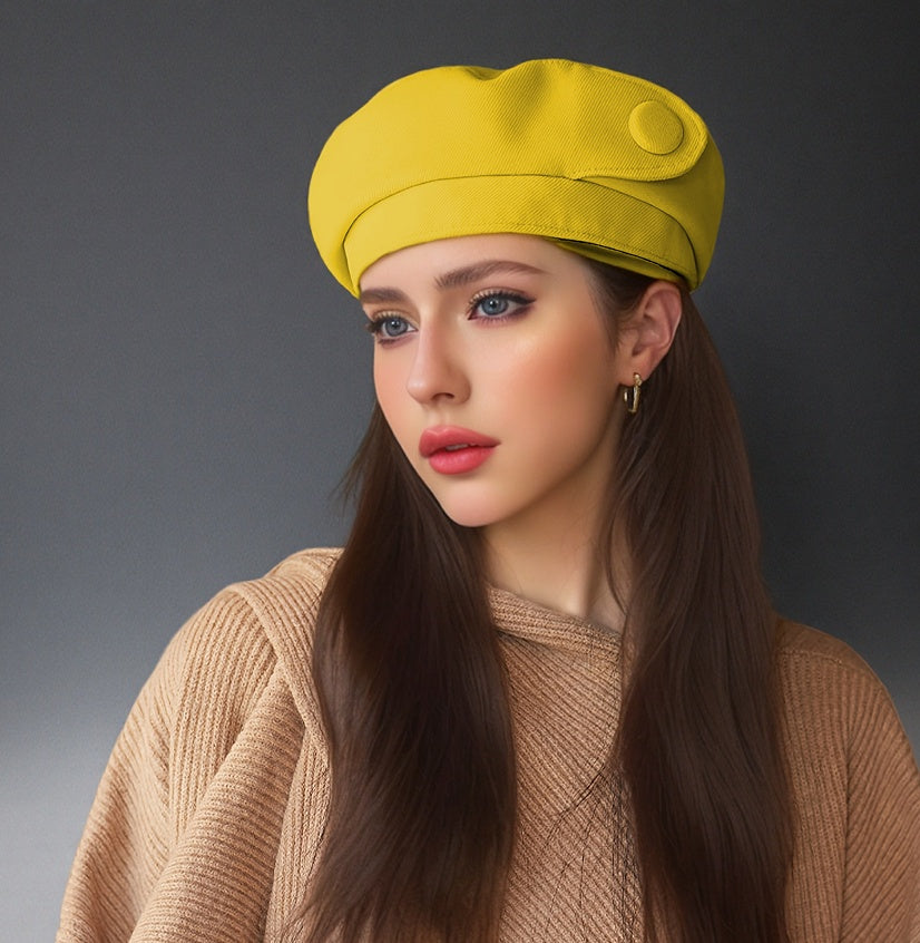 Yellow satin button beret with side button detail and rounded, structured crown.