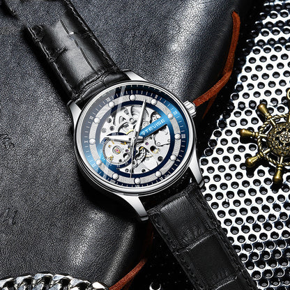 Watch with black leather strap on textured surface