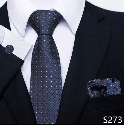 Black suit with a patterned tie and matching pocket square, labeled S273.