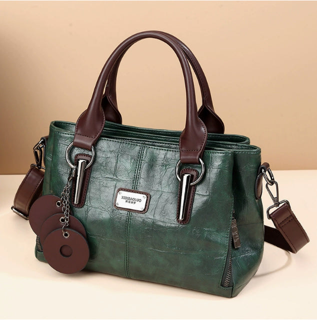 Retro classic large-capacity handbag in dark green with two top handles and crossbody strap
