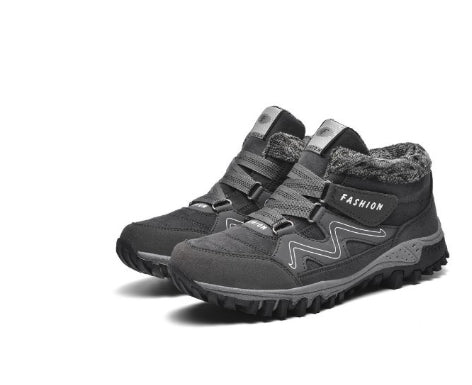 Mid-cut casual sports shoes with thick sole, gray upper with fuzzy lining and chunky lug outsole.