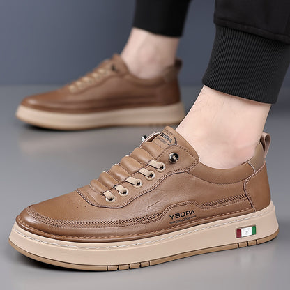 Brown leather shoes with brand logo on a gray background