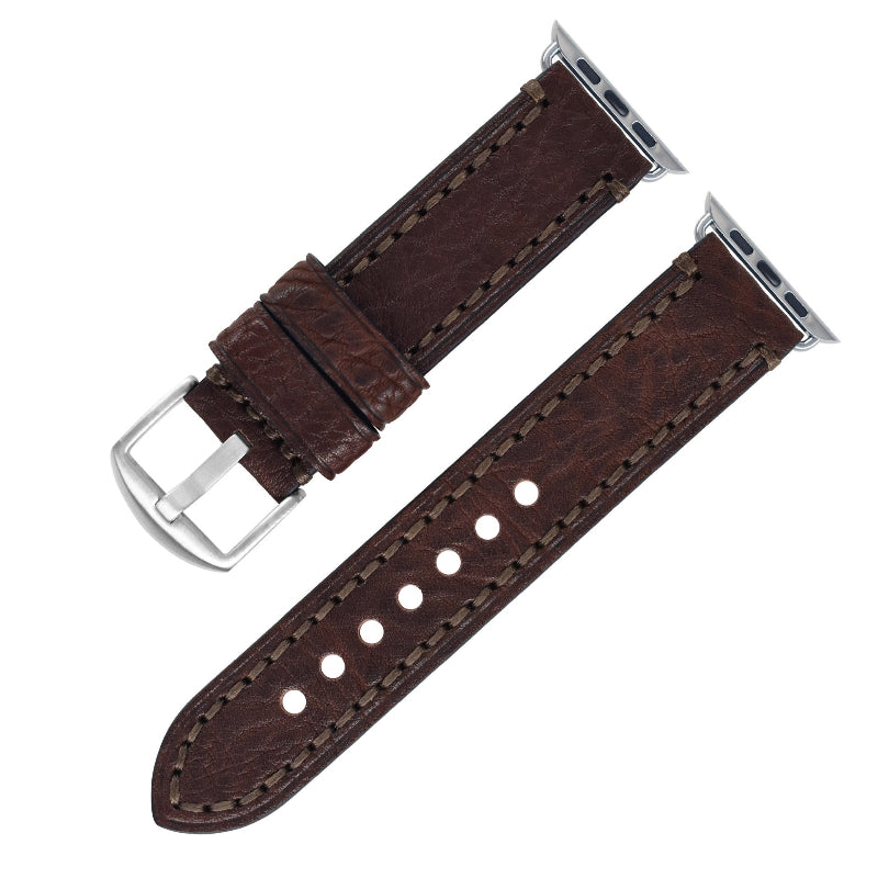 Brown leather watch strap with silver buckle on a white background