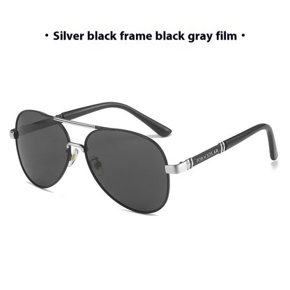 Sunglasses with silver frame and black gray lenses on a white background
