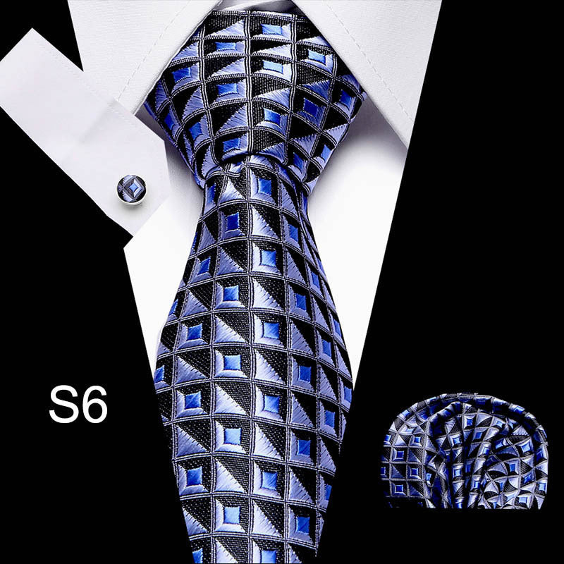 Blue and black patterned tie with matching pocket square on a white background