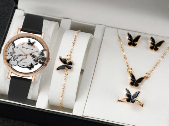 Jewelry set with watch, necklace, and earrings featuring butterfly designs.