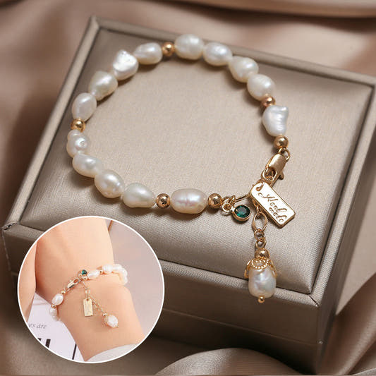Gold pearl bracelet with zircon charm and dangling pearl drop