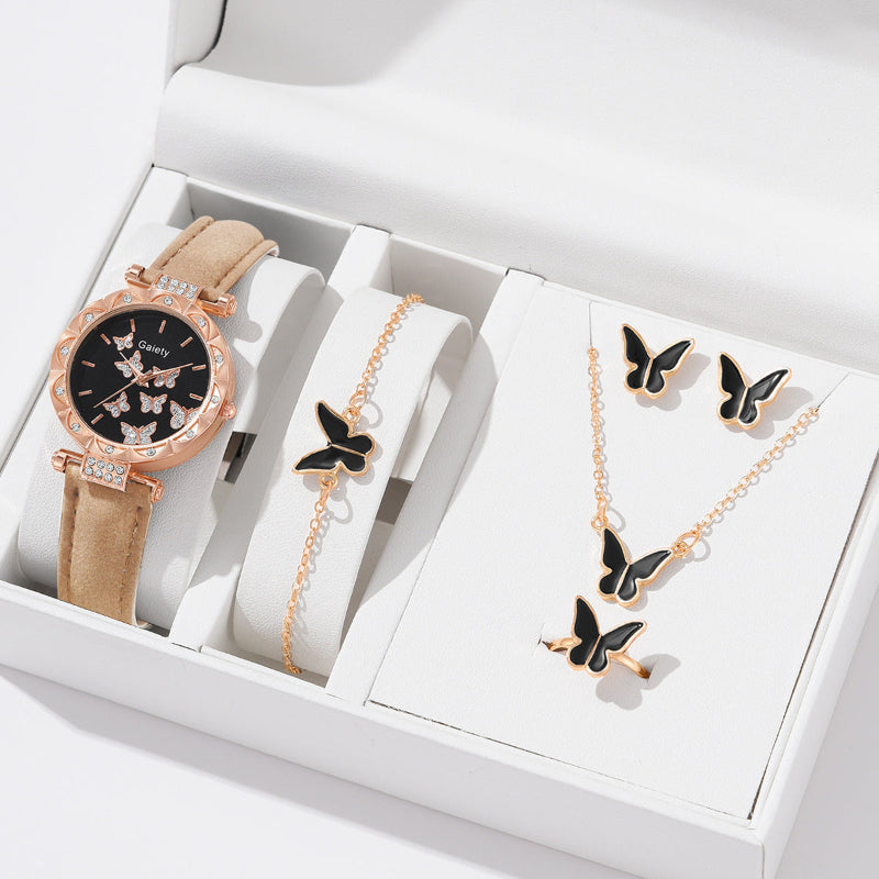 Jewelry set with a watch, bracelet, and necklace featuring butterfly designs in a white box.