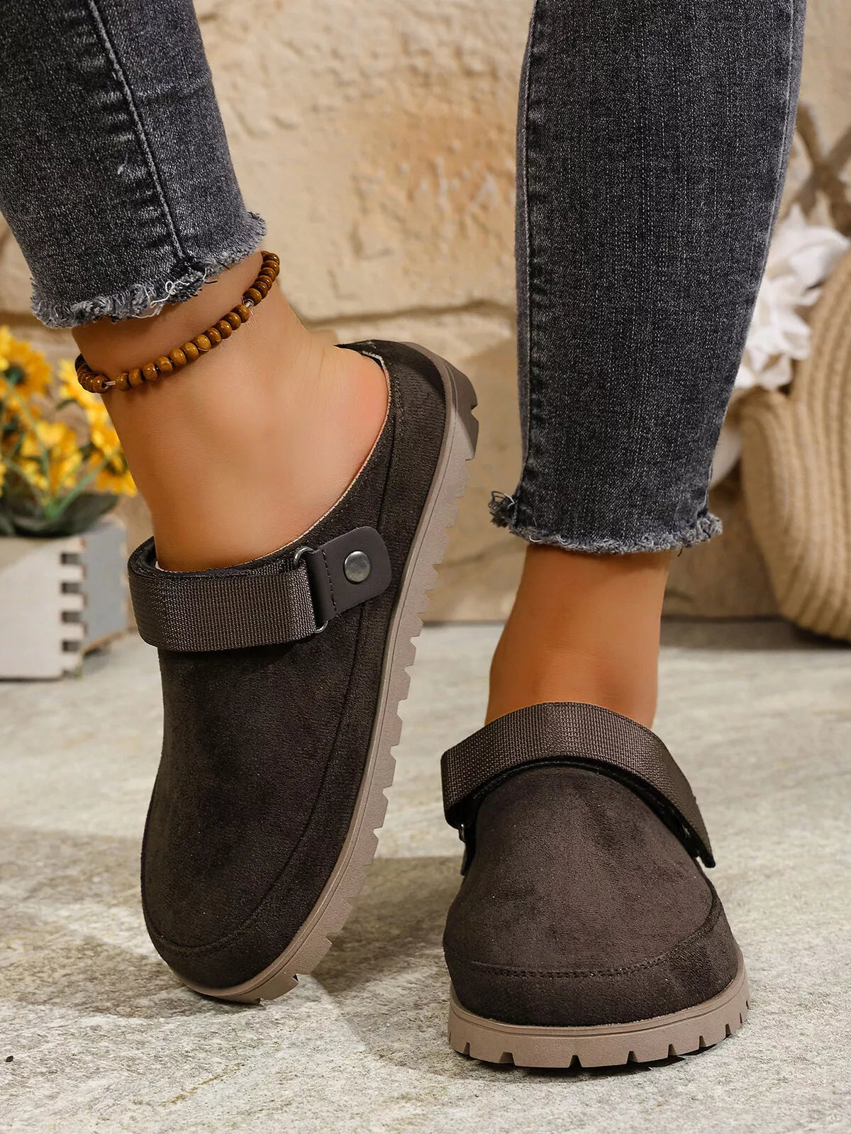 Dark gray slip-on flats with round toe, side strap, and bead anklet