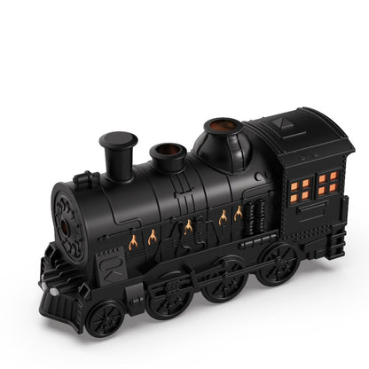 Black toy train engine on a white background